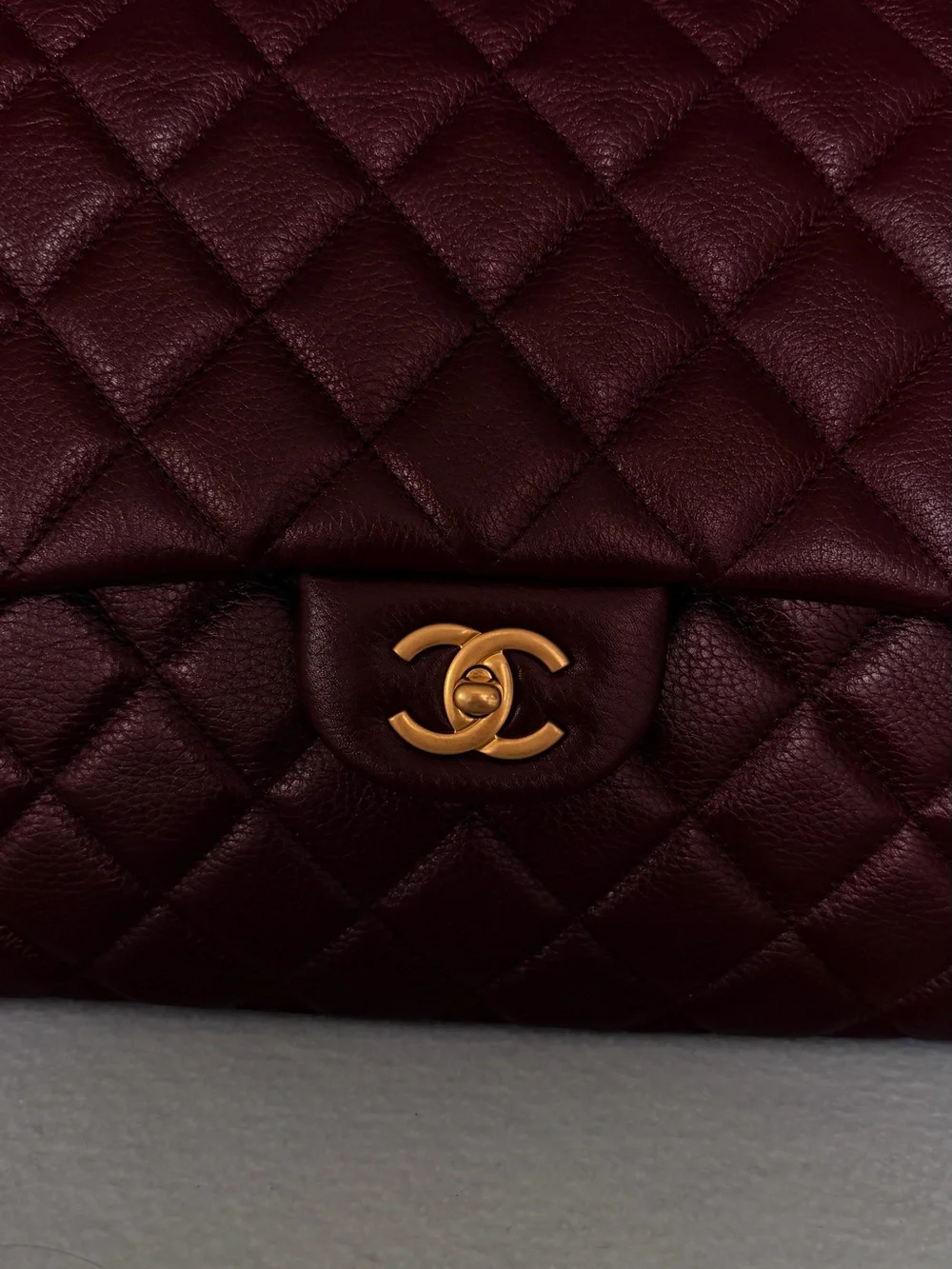 CHANEL Grained Calfskin Quilted XXL Travel Flap Bag in Burgundy Gold Hardware